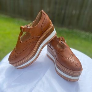 Brown and white platform faux leather shoes